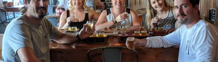 3 women and 2 men enjoying a Kelowna brewery tour at Red Bird Brewing