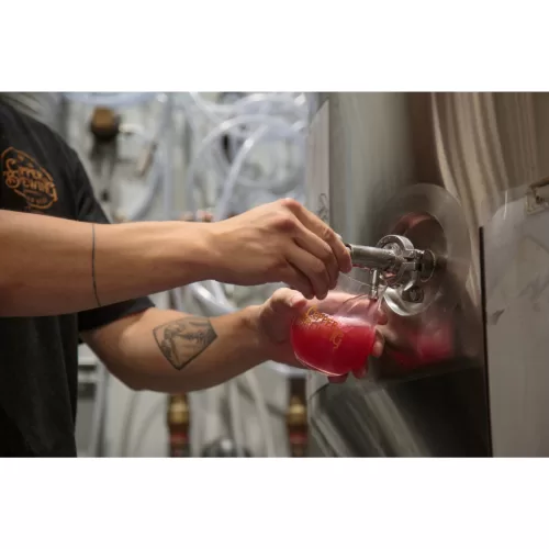 Pouring draft beer from the tank at Copper Brewing Co